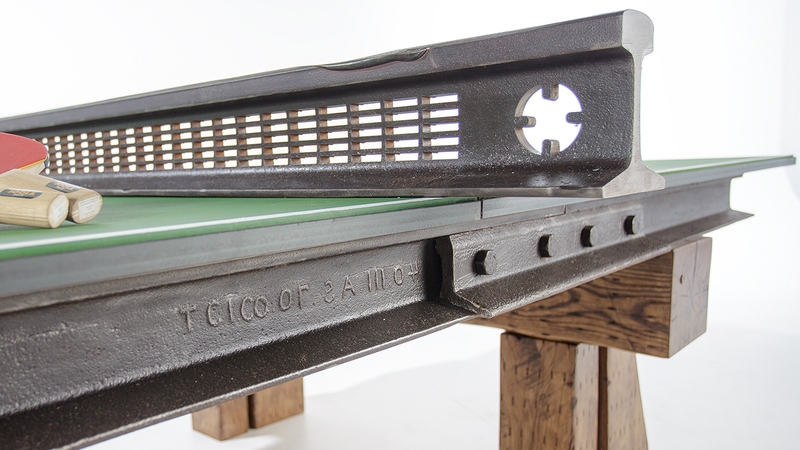 Illustration for article titled Steel and Wood From a Salvaged Railroad Support This Rustic Ping Pong Table